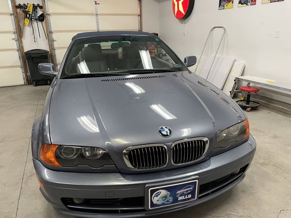 Blue BMW 3 Series convertible after hail damage repair