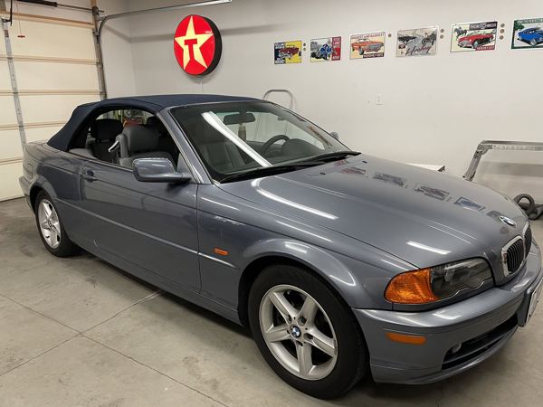 Side view of the blue BMW 3 Series convertible
