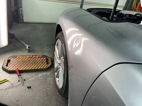Close-up of the Lexus IS fender during dent repair